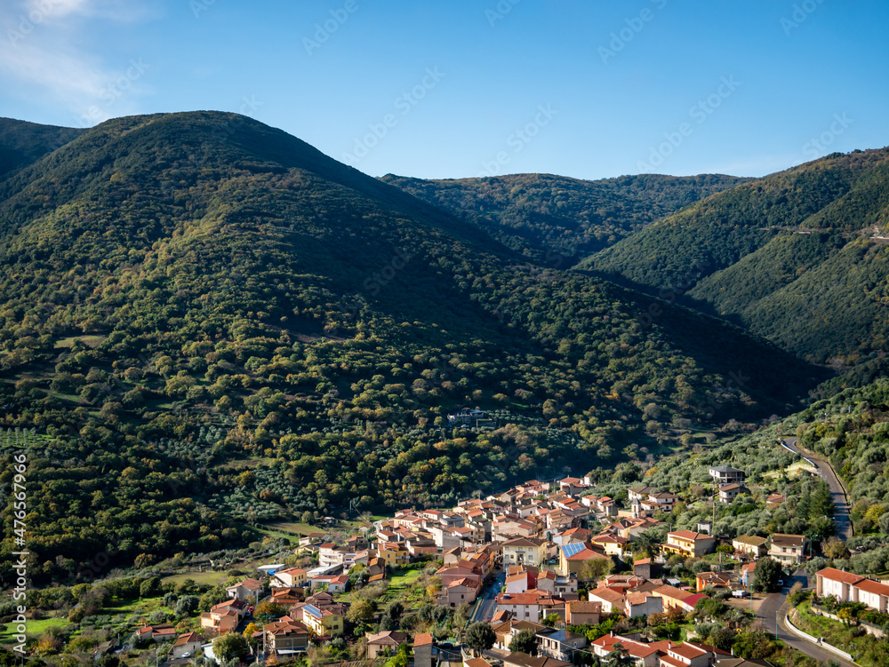 small Italian town built between green hills