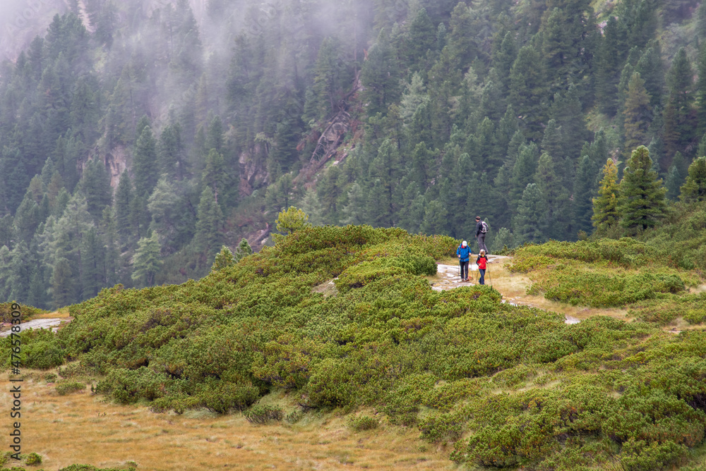 An elderly couple hiking up the mountains near Kaprun