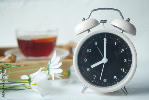 coffee mug, and clock on table close up