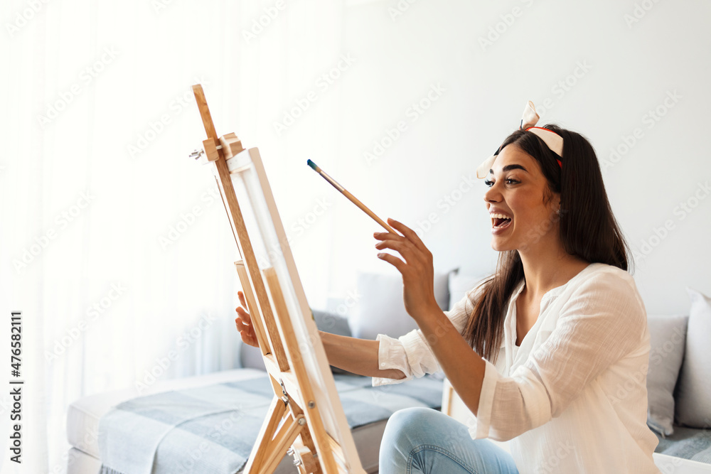 Girl painting in her apartment Girl painting in her apartment