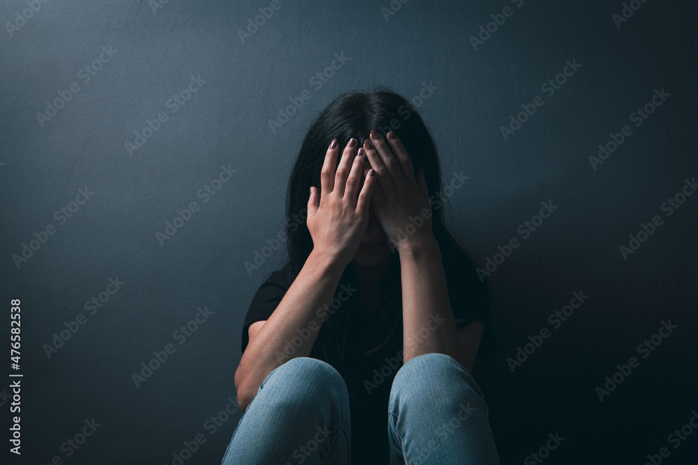 sad young woman sitting on the floor sad young woman sitting on the floor