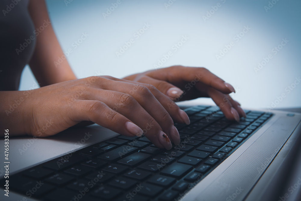 young woman sitting in front of laptop young woman sitting in front of laptop