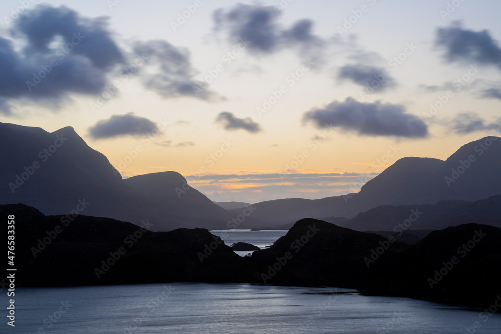 Beautiful sunrise over lochs, glens and mountains in Assynt, northern Scotland 