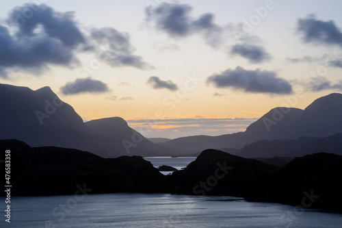 Beautiful sunrise over lochs, glens and mountains in Assynt, northern Scotland 