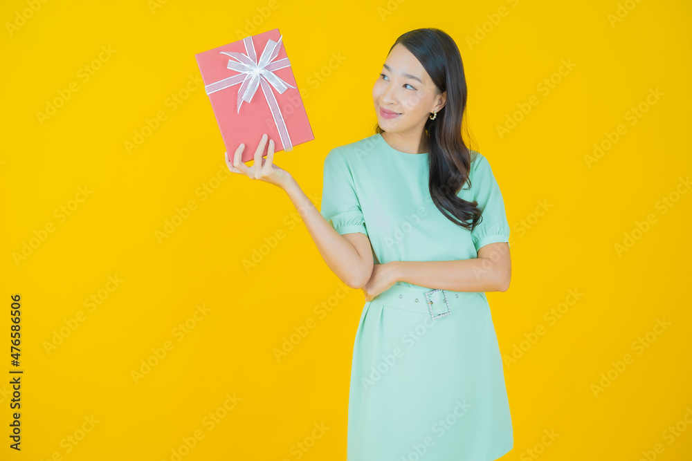 Portrait beautiful young asian woman smile with red gift box Portrait beautiful young asian woman smile with red gift box