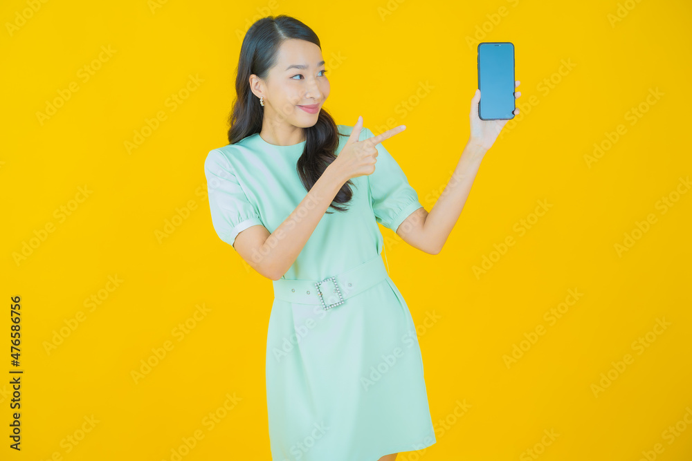 Portrait beautiful young asian woman smile with smart mobile phone Portrait beautiful young asian woman smile with smart mobile phone
