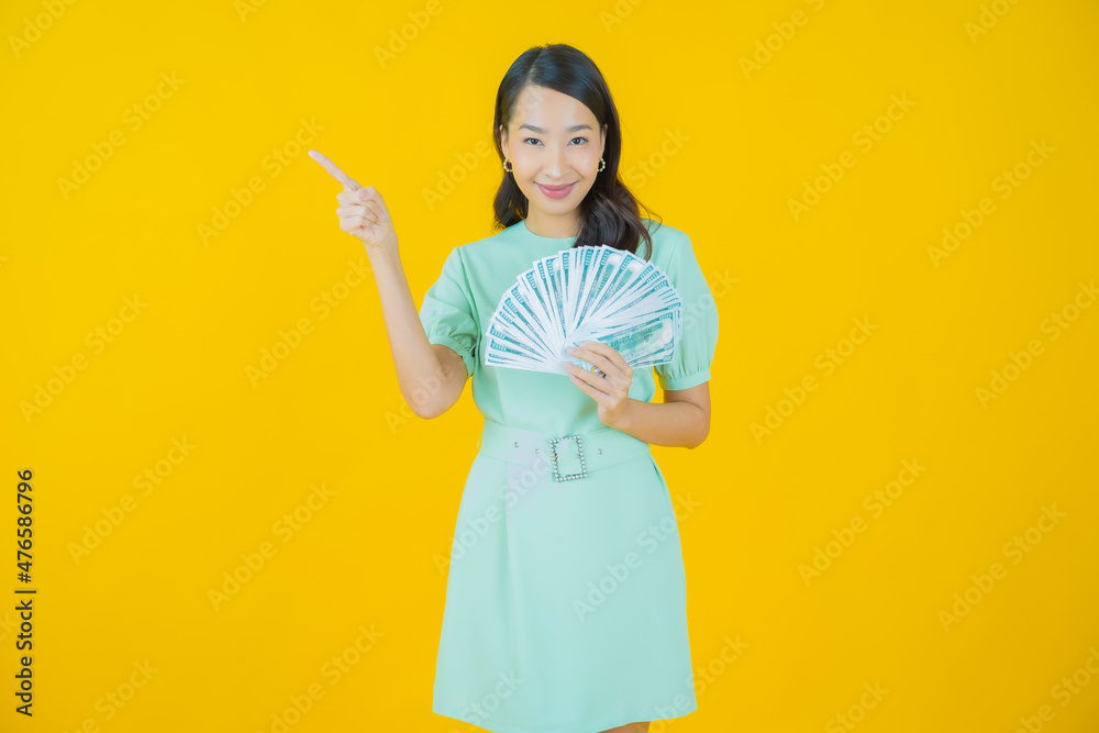 Portrait beautiful young asian woman smile with a lot of cash and money Portrait beautiful young asian woman smile with a lot of cash and money