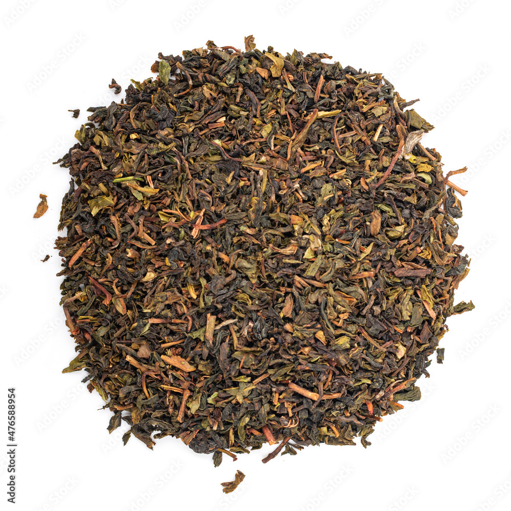 Black tea on a white background. Tea pouring. Whole leaf tea Black tea on a white background. Tea pouring. Whole leaf tea