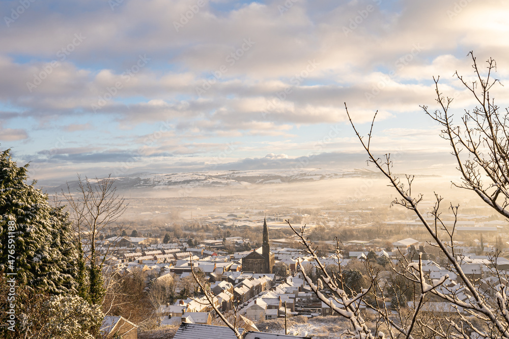 View of a snowy Morriston town centre from Trewyddfa road in Winter. Snow in Swansea, South Wales, the United Kingdom View of a snowy Morriston town centre from Trewyddfa road in Winter. Snow in Swansea, South Wales, the United Kingdom