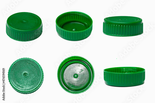 Set of plastic green bottle caps isolated on white background.