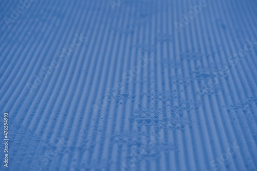 Close-up of pattern in the snow after reparation of slope by snowcat at mountain village Stoos, Canton Schwyz, on a sunny winter day. Photo taken December 20th, 2021, Stoos, Switzerland.