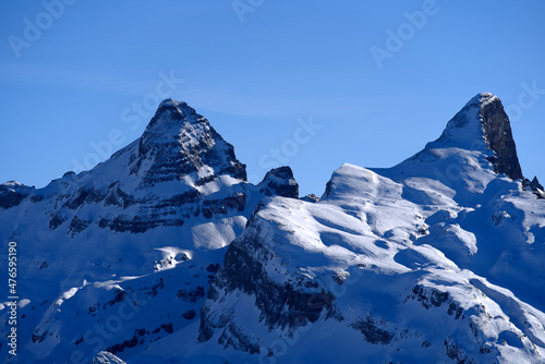 Panoramic view of mountains seen from mountain Klingenstock on a sunny winter day. Photo taken December 20th, 2021, Stoos, Switzerland.