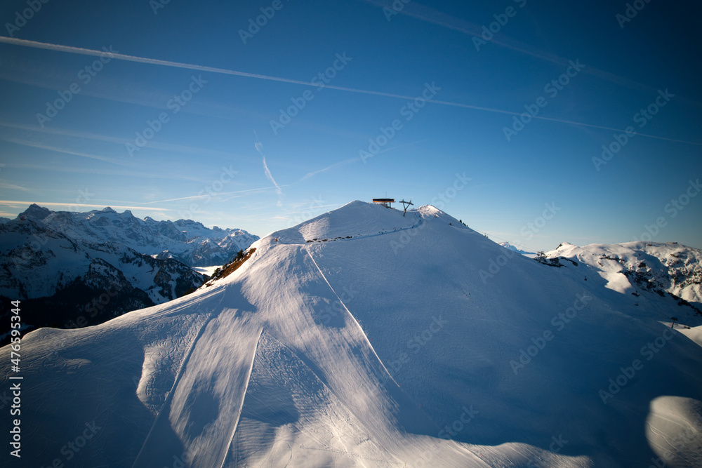 Panoramic view of mountains seen from mountain Klingenstock on a sunny winter day. Photo taken December 20th, 2021, Stoos, Switzerland.