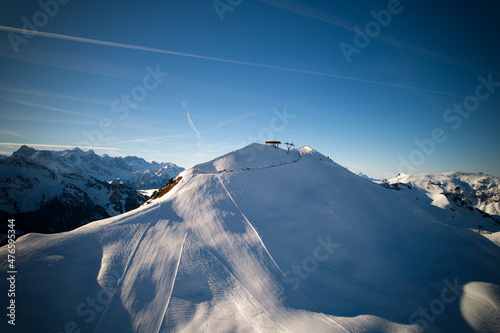 Panoramic view of mountains seen from mountain Klingenstock on a sunny winter day. Photo taken December 20th, 2021, Stoos, Switzerland.