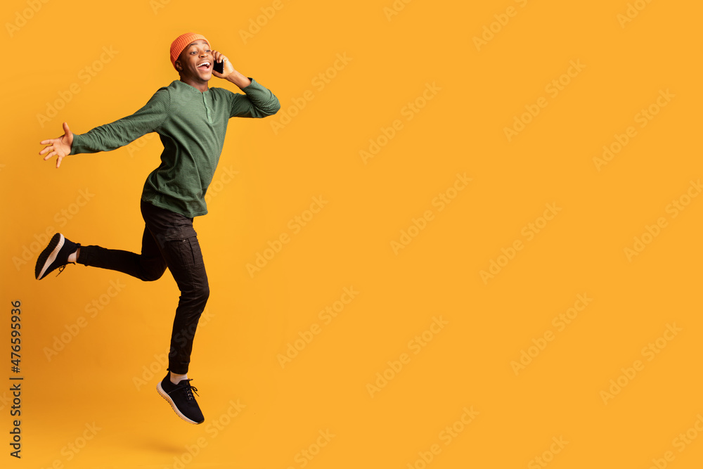 Funny Emotional Black Guy Jumping In Air And Talking On Cellphone