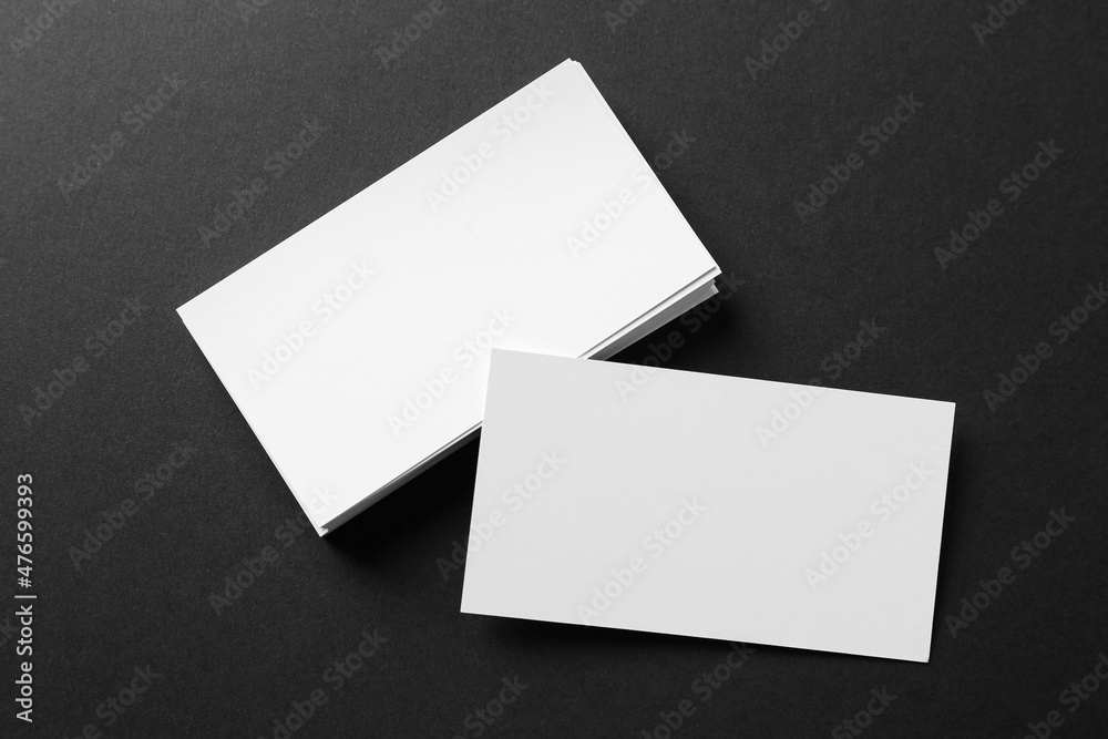 Blank business cards on black background, flat lay. Mockup for design Blank business cards on black background, flat lay. Mockup for design