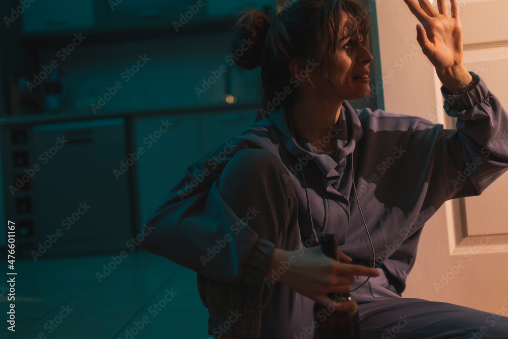 Fototapeta premium Female alcoholic drinking wine from a bottle