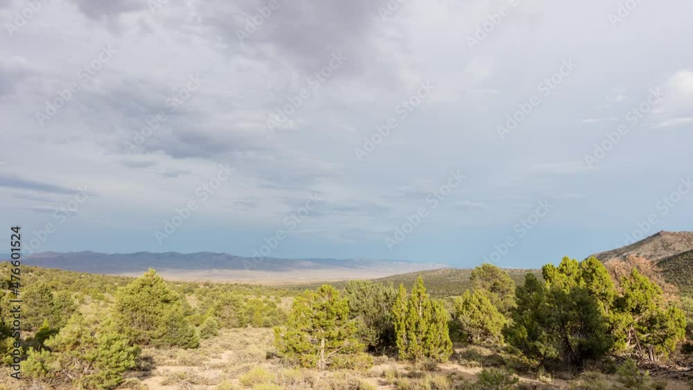 A time-lapse of rain clouds gathering in the evening over the Great Basin Desert and Shrublands south of Baker, Nevada near the Utah Border A time-lapse of rain clouds gathering in the evening over the Great Basin Desert and Shrublands south of Baker, Nevada near the Utah Border