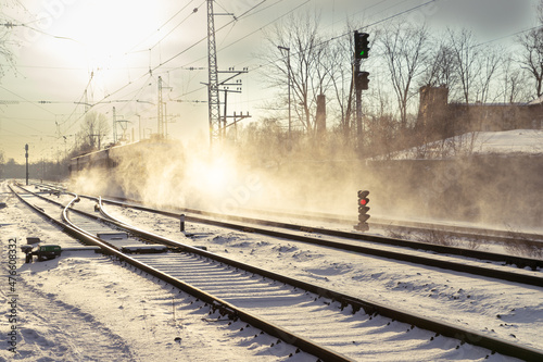 Long-tailed train lifts snow dust