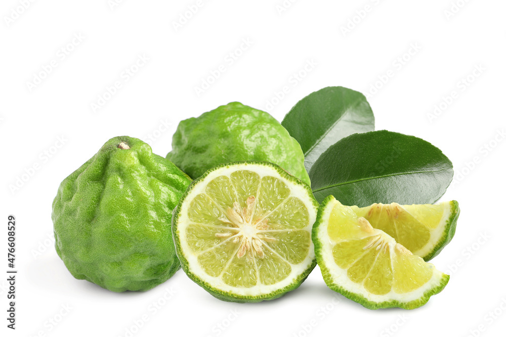 Fresh ripe bergamot fruits and green leaves on white background