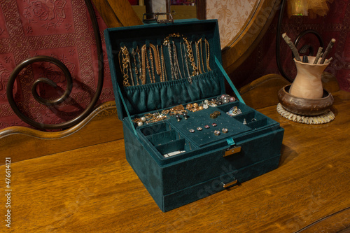 Girl's and wife's jewelry box with drawers - feminine necklace, earrings, bendants, bracelets, rings, kitsch, watch - isolated on white