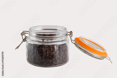 Fresh coffee beans in the airlock bottle,isolated on white.