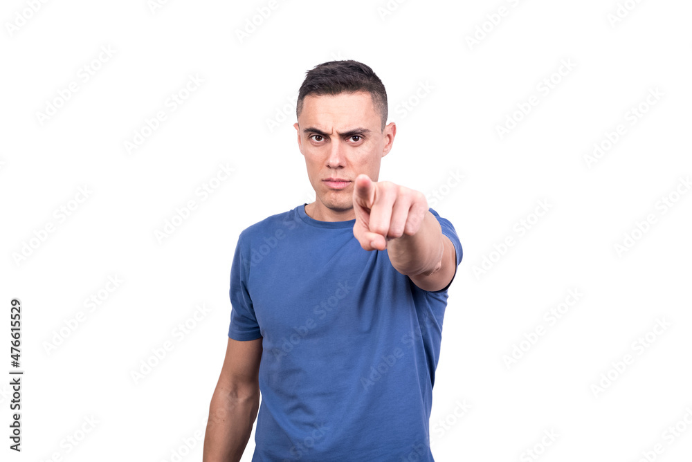 Caucasian man pointing forward with serious expression Caucasian man pointing forward with serious expression