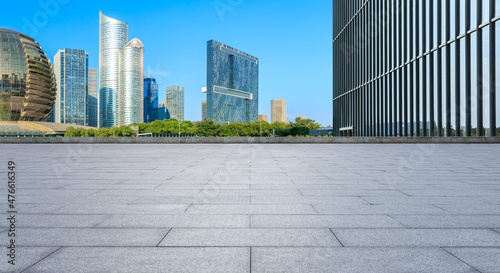 Panoramic skyline and modern commercial office buildings with empty square floors © ABCDstock