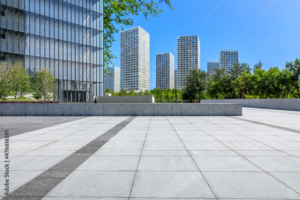 Panoramic skyline and modern commercial office buildings with empty square floors