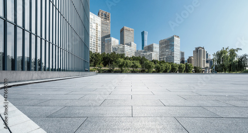 Panoramic skyline and modern commercial office buildings with empty square floors © ABCDstock