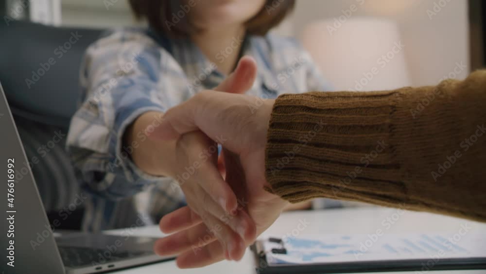 Two business people handshake after agreeing to work together at meeting, partnership concept. Two business people handshake after agreeing to work together at meeting, partnership concept.