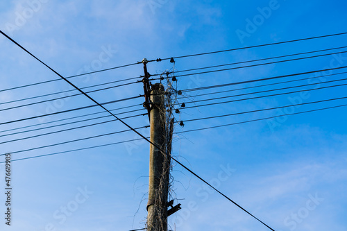 Electric power transmission lines at sky background  autumn field