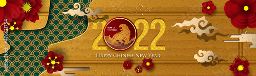 2022 Chinese New Year Greeting Card. Year of the Tiger. Chinese New-Year. Paper cut with Tiger and Flowers. gong xi fa cai 2022. Hieroglyph - Zodiac Sign Tiger. Place for your Text.