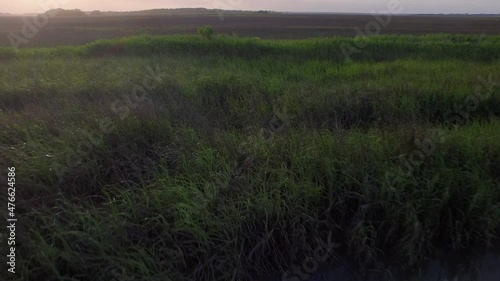 Aerial of property by a marsh