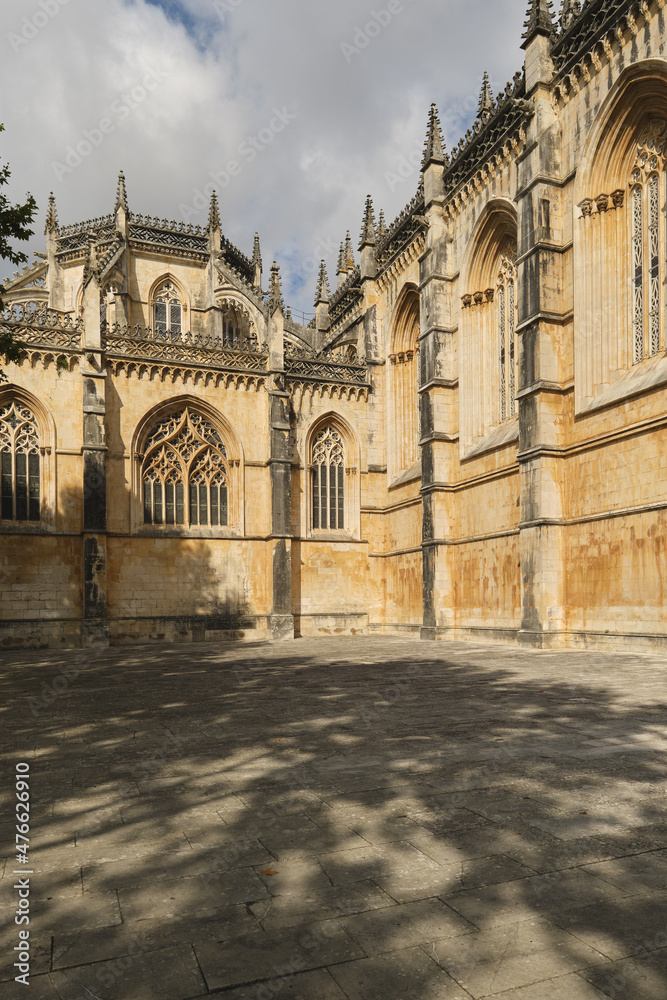 the western façade of the Batalha Monastery facing the large square with its equestrian statue of general Nuno Álvares Pereira in Batalha, Portugal the western façade of the Batalha Monastery facing the large square with its equestrian statue of general Nuno Álvares Pereira in Batalha, Portugal