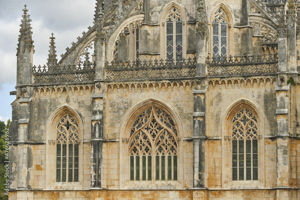 detail of the western façade of the Batalha Monastery facing the large square in Batalha, Portugal