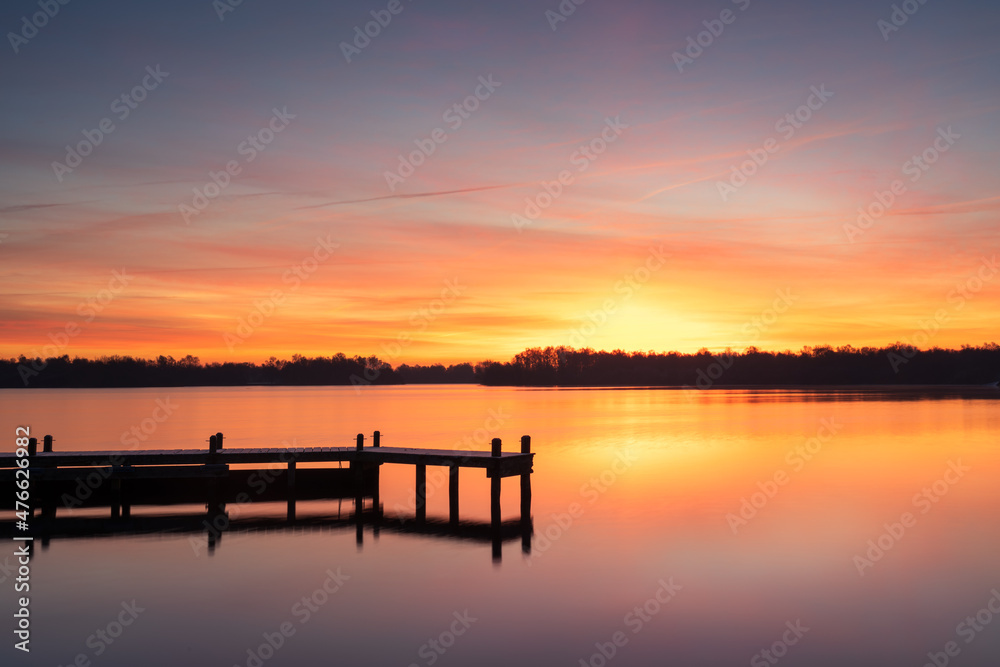 Cold and colorful dawn at a lake on a winters morning.