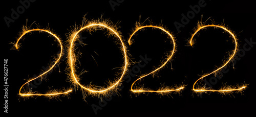 Happy New Year 2022 with sparklers on black background