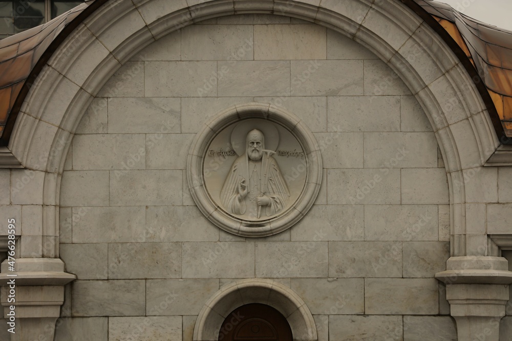 Bas-relief Patriarch Tikhon on the eastern wall of the entrance pavilion of the Church of the Transfiguration of the Lord in the complex of the Cathedral of Christ the Savior in Moscow.