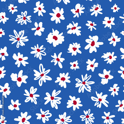 Doodled ditsy daisy seamless repeat pattern on blue background. Random placed, hand drawn vector flowers allover surface print.