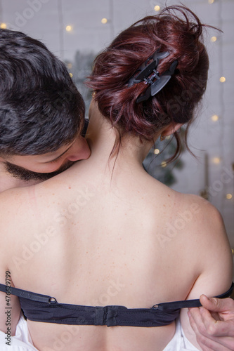 Pure passion.A man hugs and kisses a woman