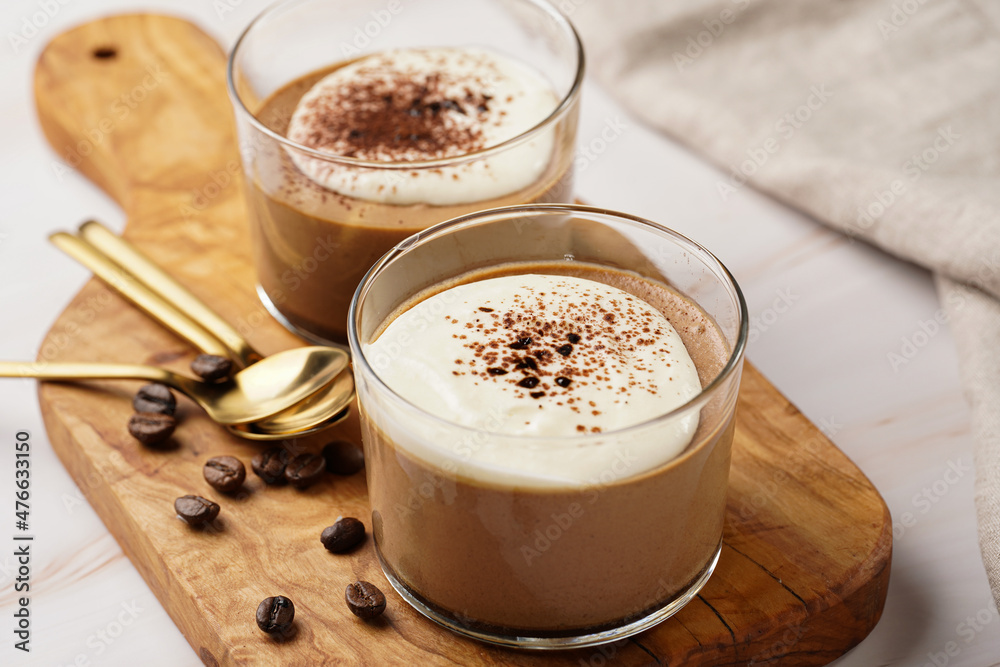Italian chocolate and coffee mousse dessert semifreddo - half-frozen ice cream with whipped cream and cocoa powder in small glasses Italian chocolate and coffee mousse dessert semifreddo - half-frozen ice cream with whipped cream and cocoa powder in small glasses