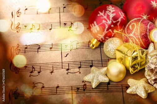 Christmas Music concept. Christmas decorations on music sheets photo