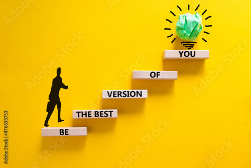 Best version of you symbol. Wooden blocks with words Be the best version of you on yellow background, copy space. Businessman icon, light bulb. Business, best version of you concept.