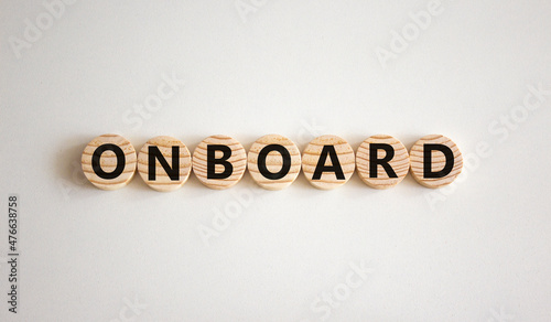Onboard and onboarding symbol. The concept word Onboard on wooden circles. Beautiful white background, copy space. Business onboard and onboarding concept.