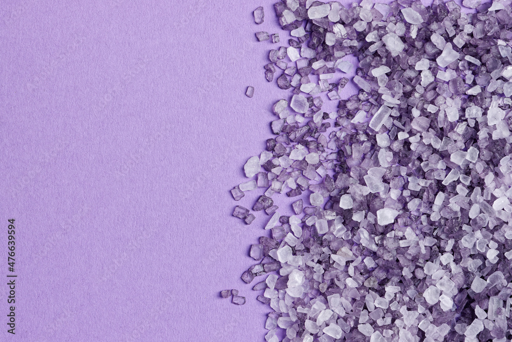 Top view of violet bath salt crystals background with copy space. Top view of violet bath salt crystals background with copy space.