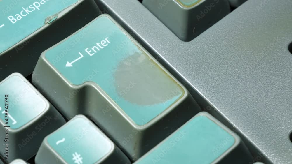 Man hitting the enter key two times, old computer, retro desktop PC keyboard object detail, finger extreme closeup Confirmation, taking action, acceptance, accepting or sending simple abstract concept