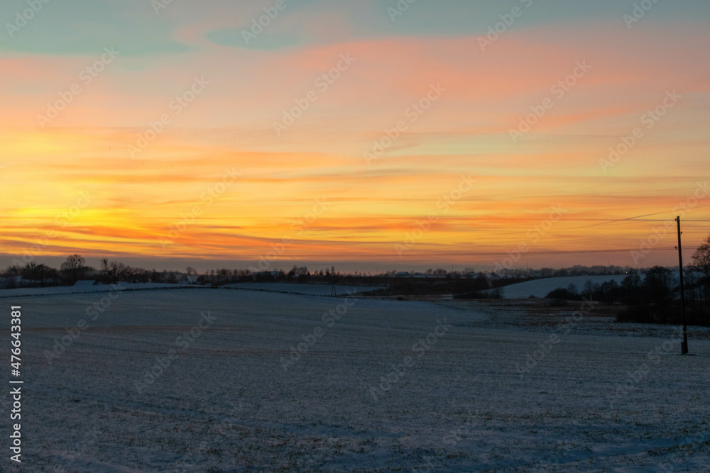 sunset over the winter field sunset over the winter field