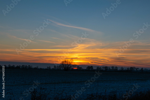 sunset over the field photo