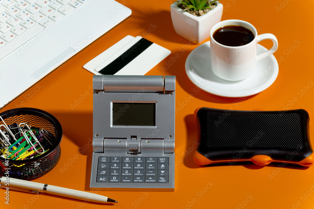 Items for accounting and business in the office on a bright colored background. Items for accounting and business in the office on a bright colored background.